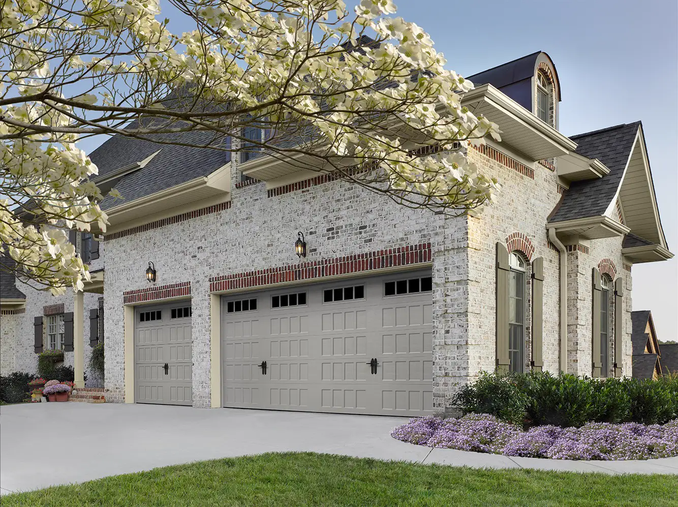 Modern white steel garage door installation
